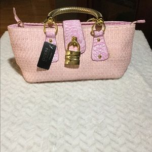 Pink weave Guess purse
